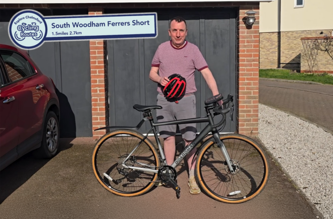 Man standing with a bicycle