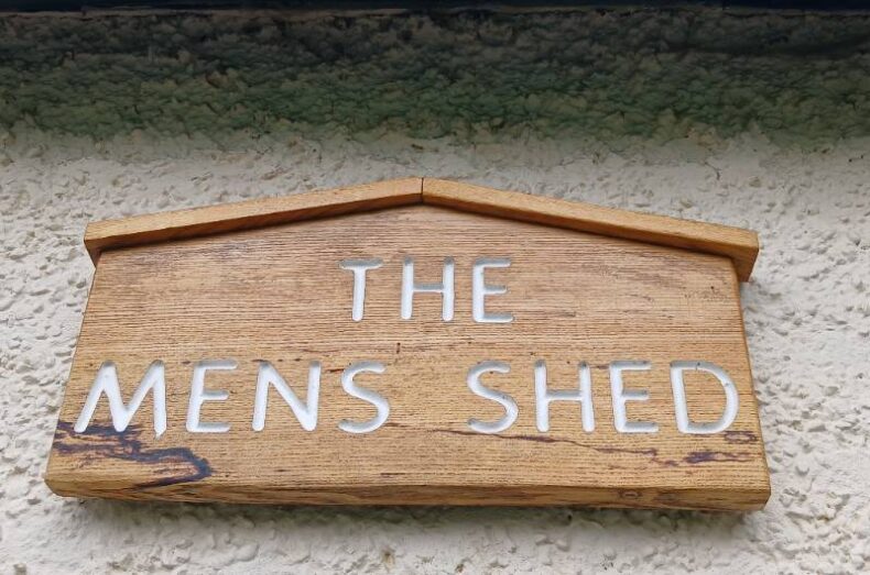 men in shed plaque